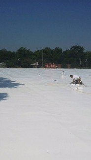Man on Roof Working